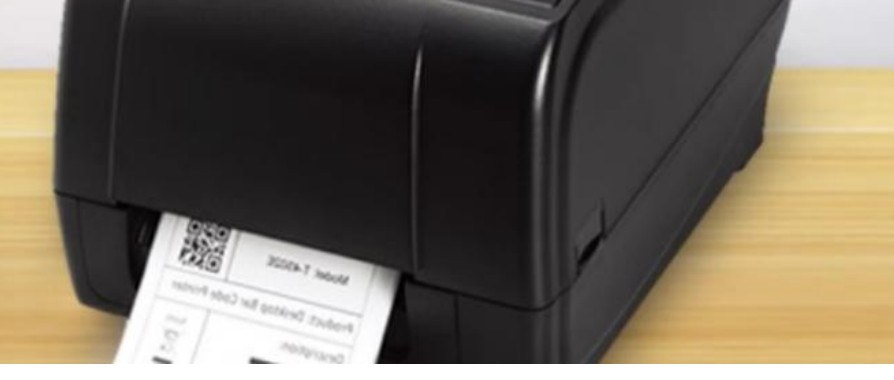 Desktop RFID printer and encoder feeding a printed label
